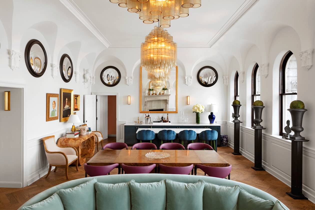 The Riggs Suite featuring a modern design living room with numerous seats.