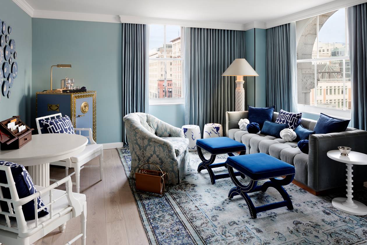 Beautiful living room at the First Lady Caroline Harrison suite at Riggs DC, featuring elegant blue and white furnishing.